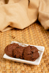Delicious homemade chocolate cookies on a bamboo mat