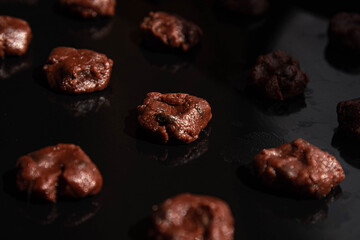 Delicious homemade chocolate cookies on a black tray