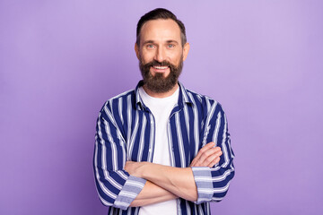 Photo of positive mature man cross hands smile in camera isolated over purple color background