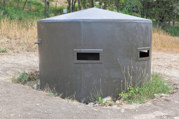 Fototapeta premium Metal bunker in the exposition of defensive fortifications and captured artillery of German troops on Sapun Mountain in the hero city of Sevastopol, Crimea