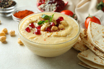 Concept of cooking hummus on white textured background