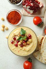 Concept of cooking hummus on white textured background