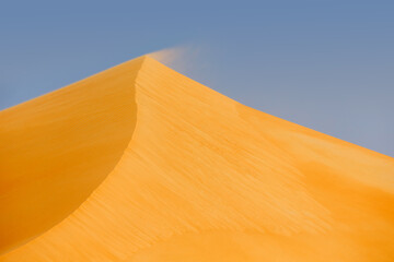 Wind blowing the sand in the desert in UAE
