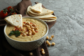 Concept of tasty eat with hummus and pita, space for text