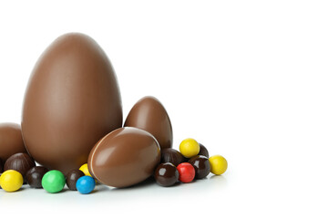 Easter chocolate eggs with candies isolated on white background
