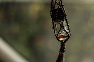 Fototapeta na wymiar hanging parfume bottle