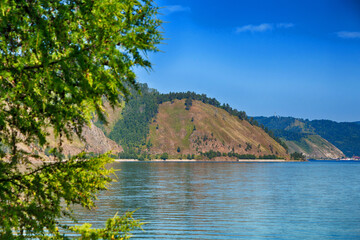 Beautiful natural summer landscape. Mountains, sky, water. Lake Baikal.