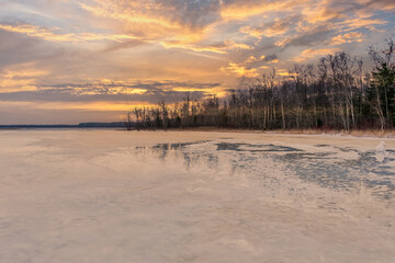 Frozen Lake in February in Latvia with Cloudscape
