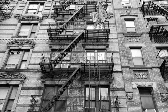 New York City fire escape stairs. Black and white photo.