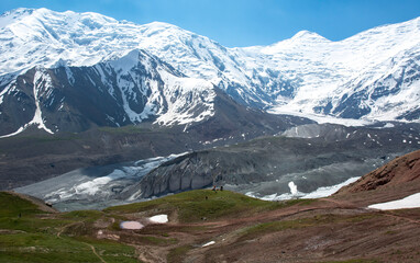 mountain range landscape with huge glacier moraine in daylight 