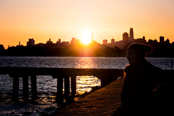 young girl with panoramic views of san francisco and sunrise