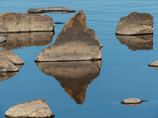 stones in sea reflection