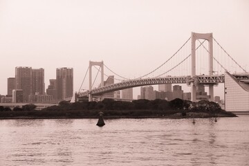 Fototapeta na wymiar Rainbow Bridge in Tokyo, Japan - sepia Tokyo