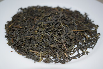 Fototapeta premium Green, black, herbal tea on a white background.