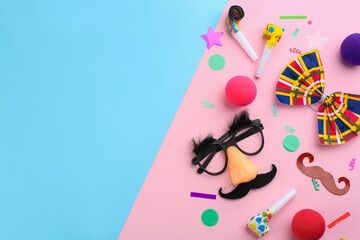 Flat lay composition with clown's accessories on color background. Space for text