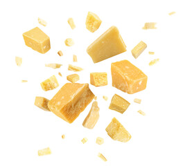 Pieces of delicious parmesan cheese flying on white background