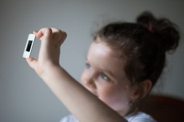 Young girl child looking at vintage retro slide