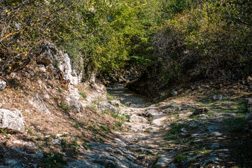 Ancient stony road through Chufut-Kale, medieval cave settlement in Crimea