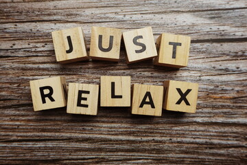 Just Relax alphabet letters on wooden background