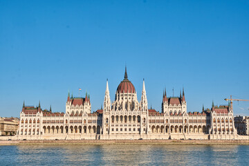 Fototapeta na wymiar Hungarian Parliament by day, Budapest. One of the most beautiful buildings in the Hungarian capital.