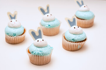 Bunch of Easter muffins on white background. Easter concept. Rabbit cupcake