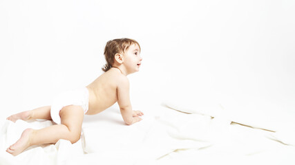 Obraz premium Smiling crawling baby on the floor