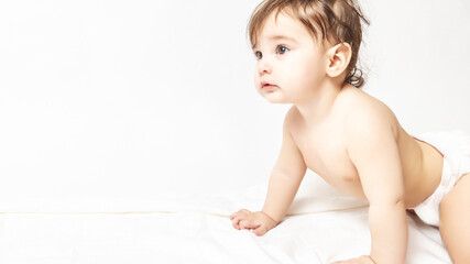 Obraz premium Funny crawling baby wearing a diaper
