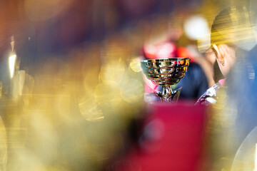 Cup held by a girl photographed close up