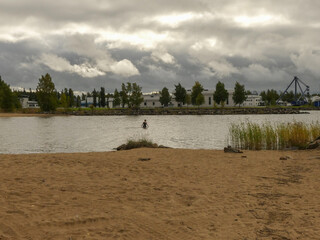 woman going for a swim in the sea