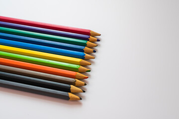 Fototapeta premium Selective focus. Colored pencils close-up, side view with macro. trim share.