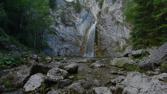 salza waterfall in the forest and mountains while hiking