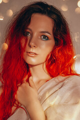 red-haired European girl with beautiful eye makeup in the sunlight