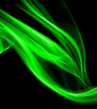 swirling movement of green smoke group, abstract line Isolated on black background