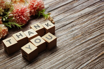 Thank You alphabet letters with space copy on wooden background