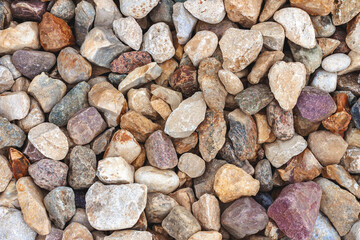 Background from multicolored rough rubble close up
