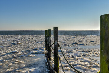 Floating ice on the Wadden Sea at sunrise near 't Kuitje, Den Helder, Netherlands. © Bert