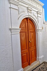 wooden door in the historic greek town of Lindos in Greece on a holiday day