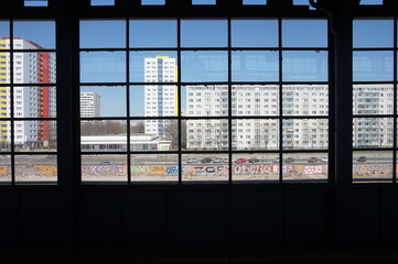 View on buildings through big glass window in Berlin