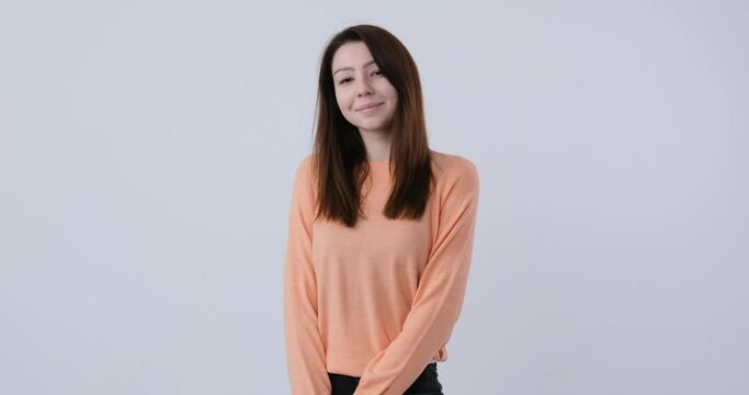 Beautiful caucasian woman with pretty face, gentle shy looking at camera