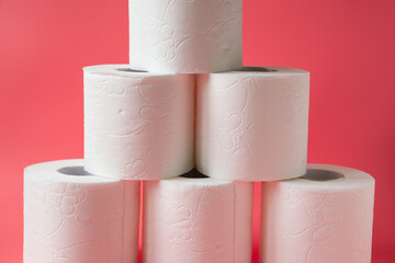 Toilet paper on pink background