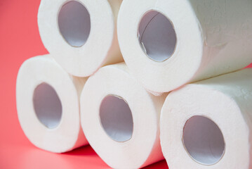 Toilet paper on pink background