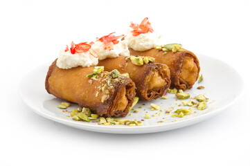 Arabic Cuisine; Traditional Ramadan dessert "znoud el set" , delicious Ramadan dessert served with roasted nuts and honey syrup.