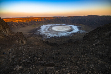 Wahba crater of Saudi Arabia (White sodium phosphate crystals create a milky lake whenever rain...