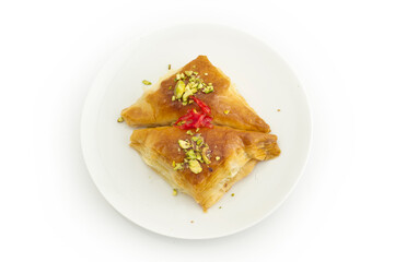 Oriental Arabic sweet warbat with qishta, kadayif, kunafa, with pistachio and cheese.