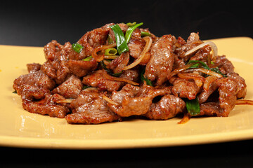 Chinese WOK dish. The lamb in the spices with the onions.