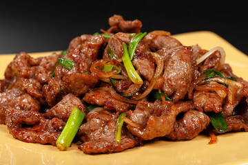 Chinese WOK dish. The lamb in the spices with the onions.