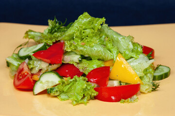 Fresh vegetable salad with tomatoes, cucumber and pepper