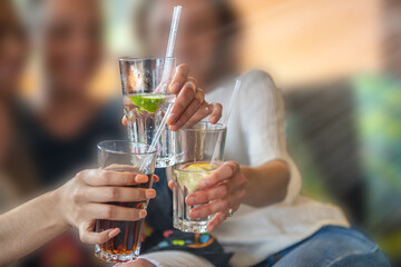 Group of happy friends drinking beer at brewery bar restaurant - Friendship concept with young people having fun together at cool places - Focus on glasses
