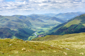 Looking down to Glen Lyon from the mountain summit of Meall na Aighean in the Scottish Higlands, UK landscape.