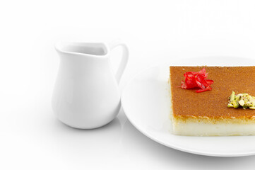 Turkish dessert kunefe, kunafa, kadayif with pistachio powder and cheese, served hot, very sweet. Turkish traditional dessert.Lebanese dessert of Kunafa isolated on white.